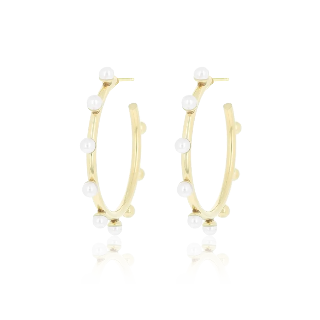 Gold coloured earrings with pearls